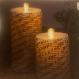 Set of Luminara real flame-effect basket weave pillar candles.